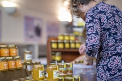 Fran Kimpton (Kennet BKA) lays out local honeys for sale at the Wiltshire Bee & Honey Day 2019