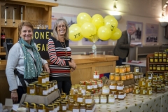Angela Barlow and Pippa Gillham selling honey at the Wiltshire Bee & Honey Day 2019