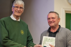 WBKA President Alan Stonell presents the Basic Certificate in Beekeeping to a beekeeper at the Wiltshire Bee & Honey Day 2019